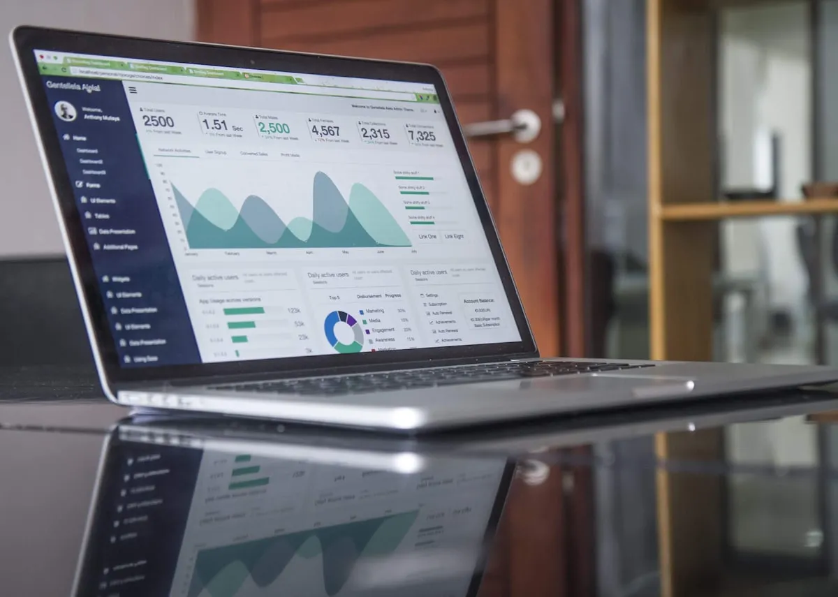 Analytics dashboard on a laptop showing business metrics — agents can query systems like these and summarise the data in plain language