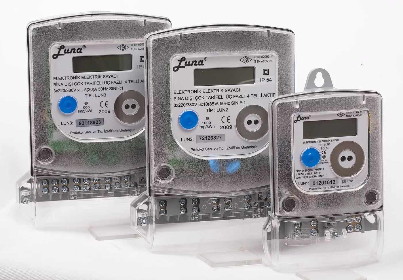 A row of electronic electricity meters with digital displays