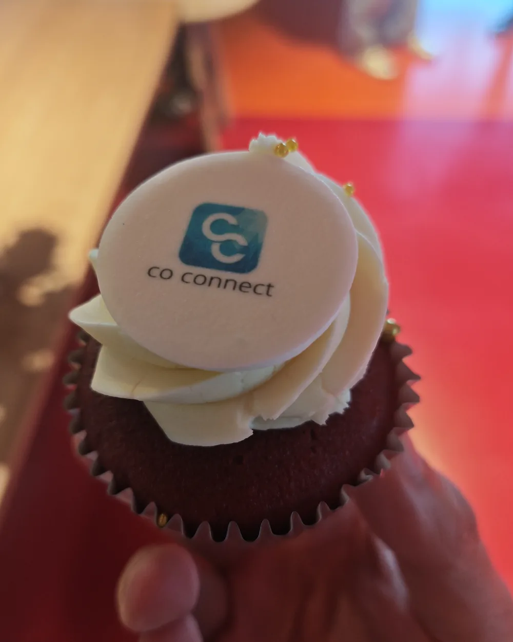 A cupcake iced with the Co-Connect logo at the Google for Startups Accelerator bootcamp