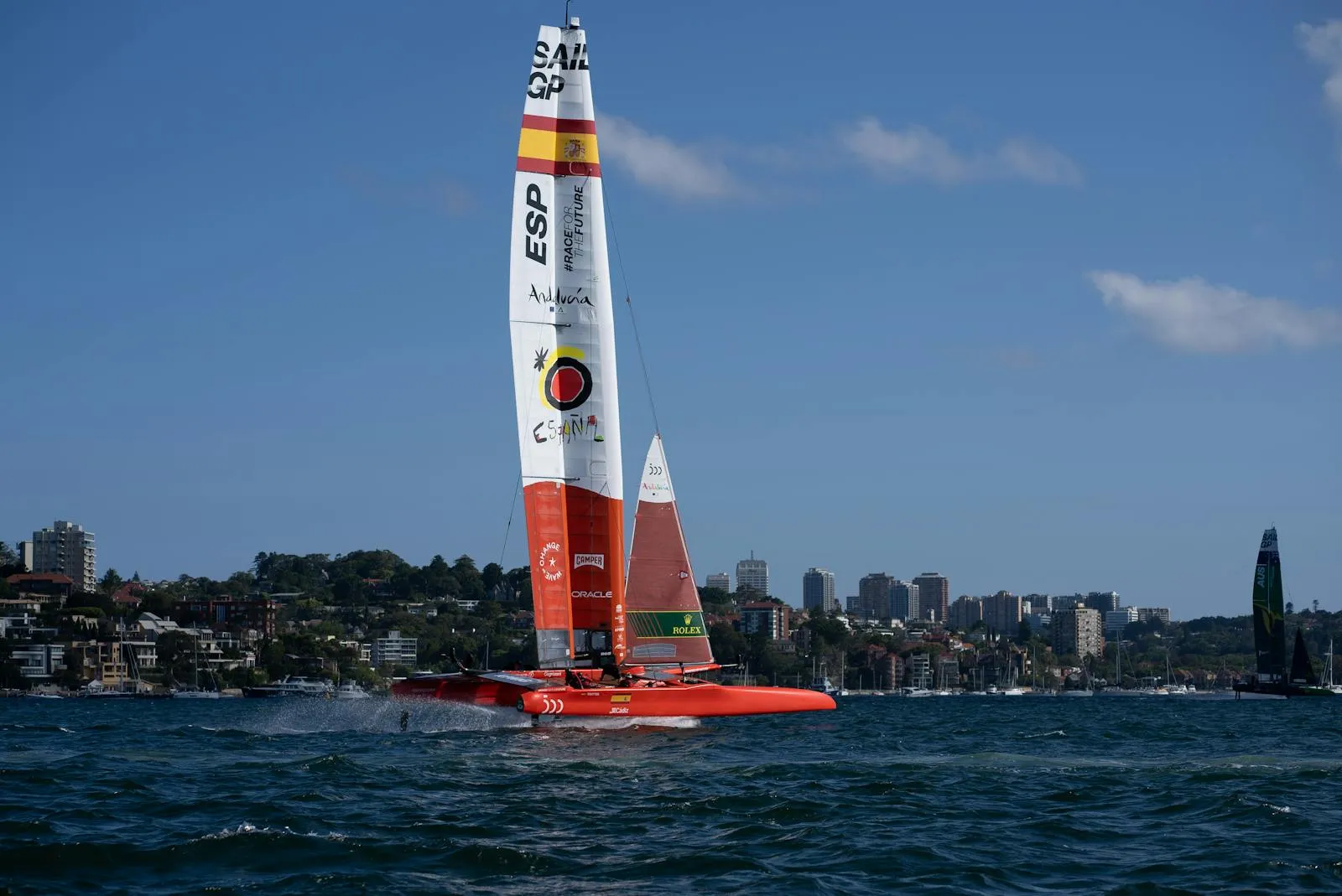 SailGP F50 foiling catamaran racing at speed with spray — the fleet's 125 sensors per boat generate 360,000 data points per second across all boats